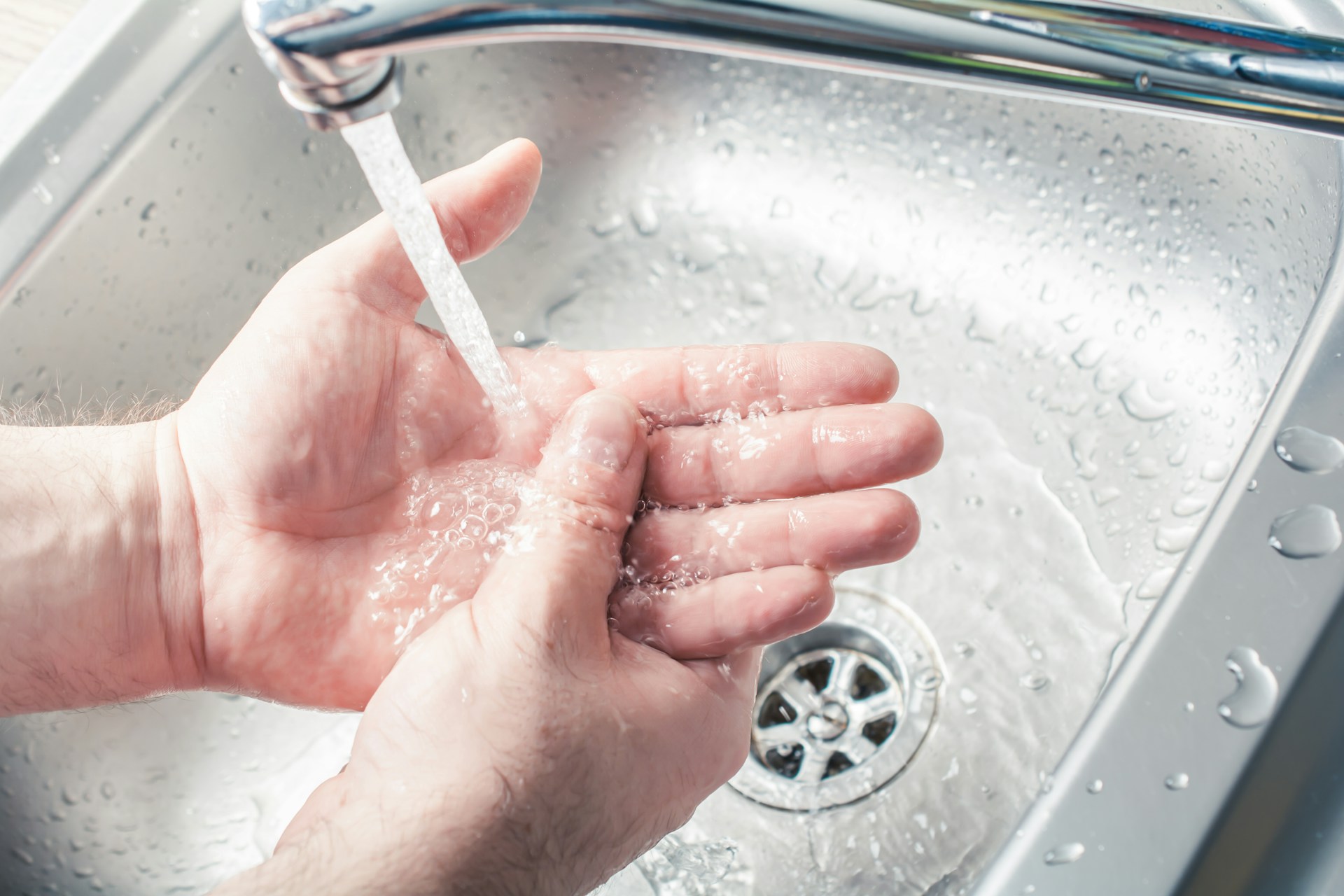 washing hands in the sink